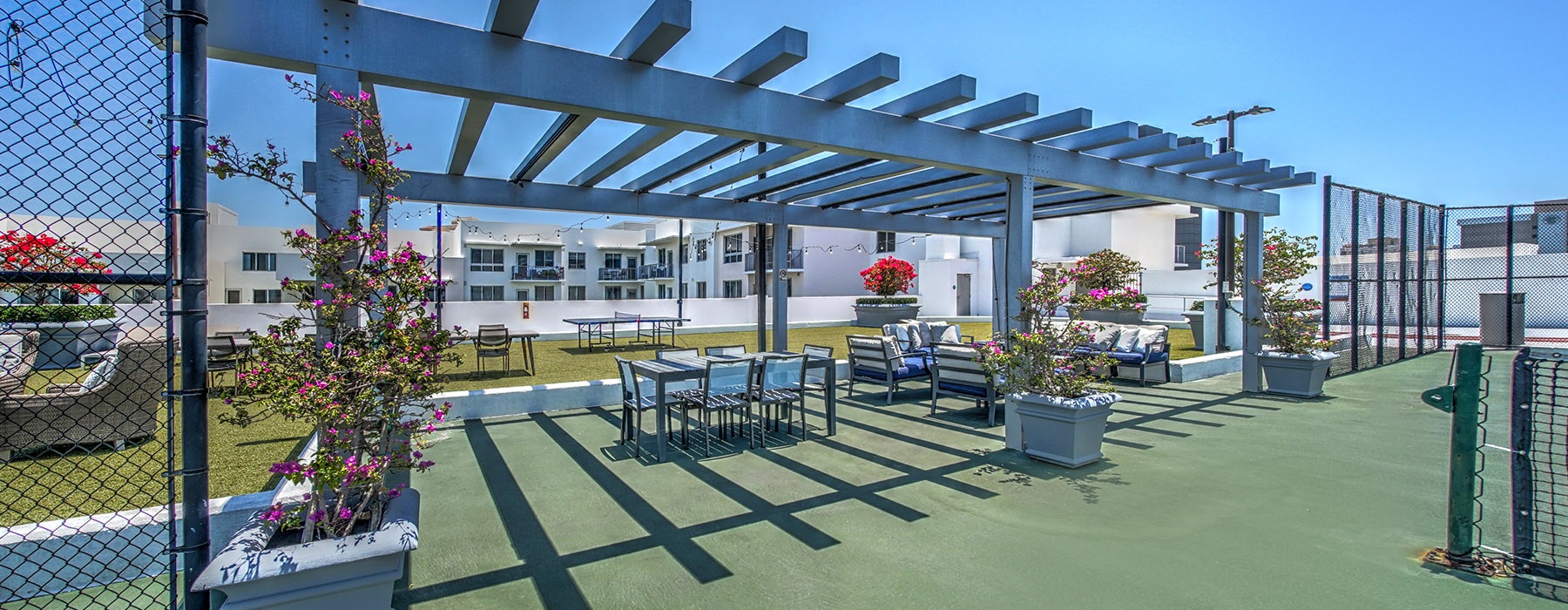 Large rooftop deck with tennis court 